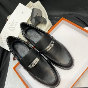 Hermès Kelly buckle loafers.