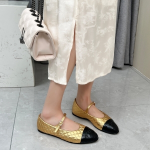 Chanel-style black and gold diamond-patterned Mary Jane flats