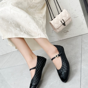 Chanel-style all-black diamond-quilted Mary Jane flats