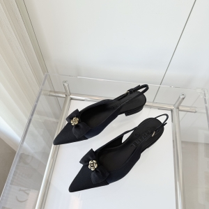 Chanel-style camellia-decorated black open-back sandals